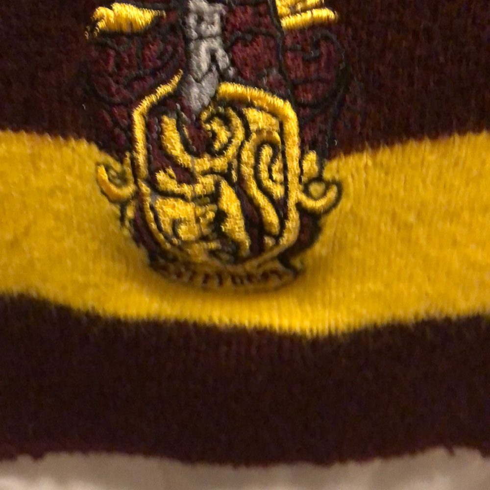 Gryffindor colored scarf with a small Gryffindor.